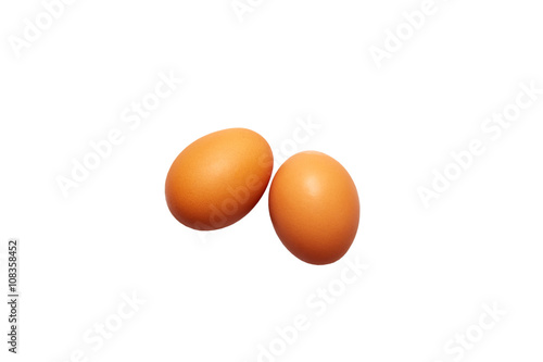 two fresh eggs on a white background