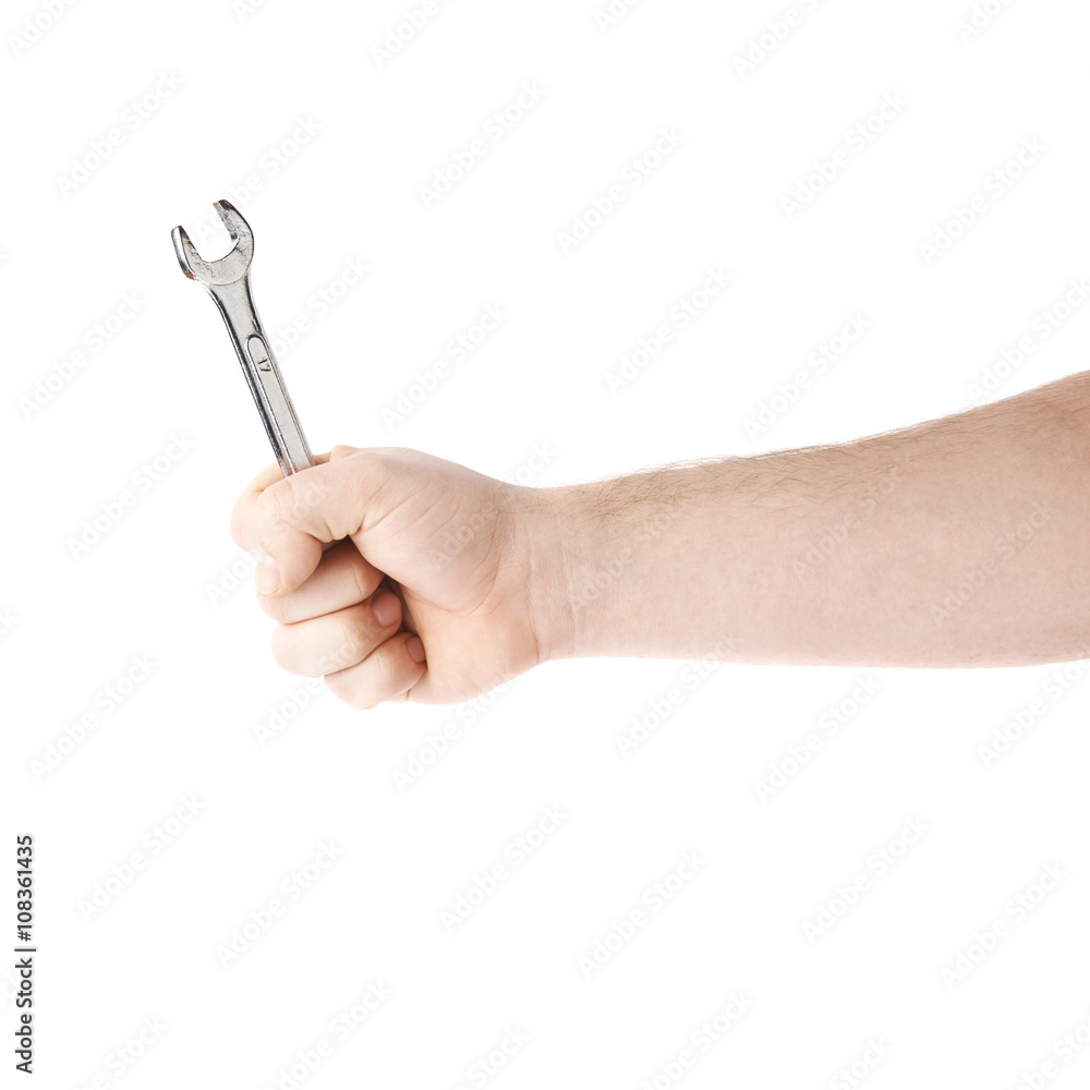 Hand holding a wrench tool, composition isolated over the white background Hand holding a wrench tool, composition isolated over the white background