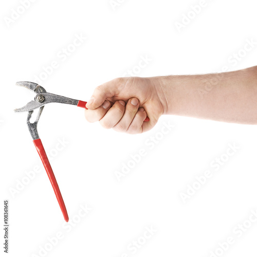 Hand holding a plumber wrench tool, composition isolated over the white background