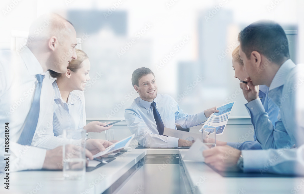 group of smiling businesspeople meeting in office group of smiling businesspeople meeting in office