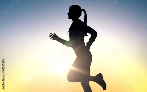 Fototapeta Naklejka Na Ścianę i Meble -  happy young sports woman running outdoors