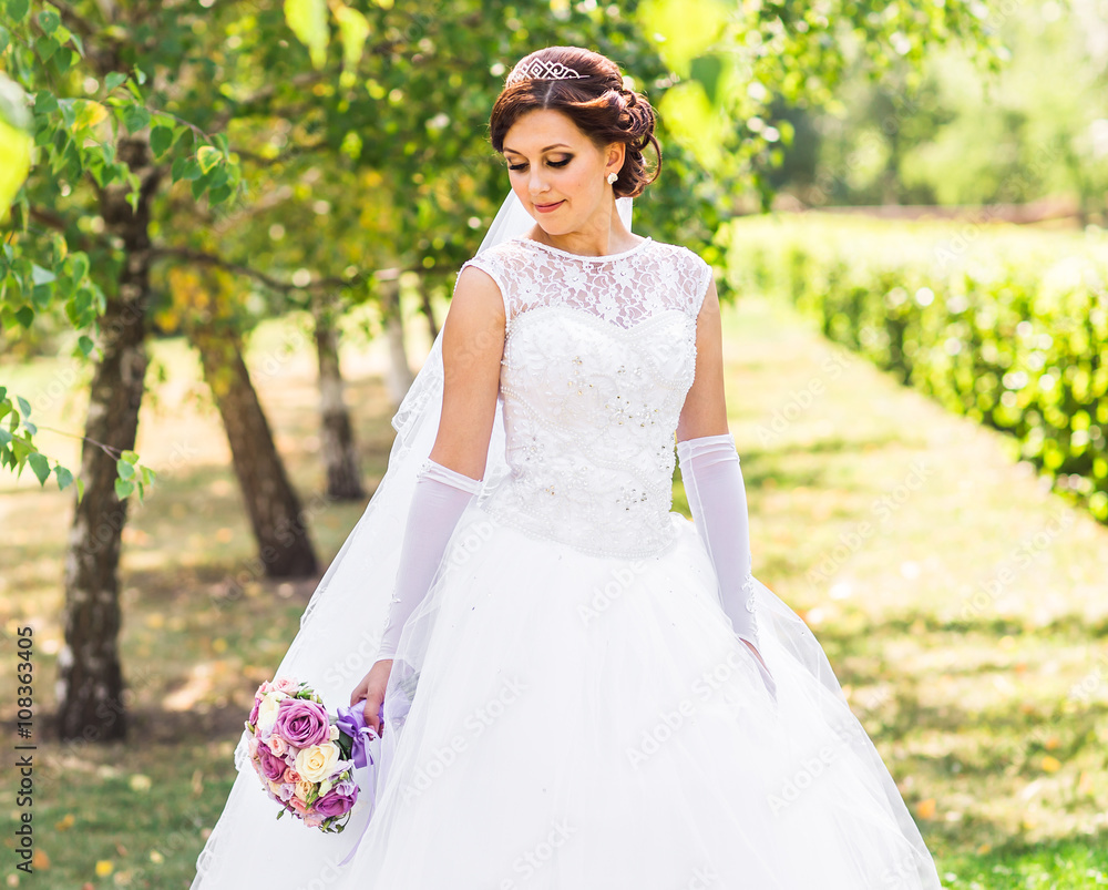Beautiful wedding bouquet in hands of the bride Beautiful wedding bouquet in hands of the bride