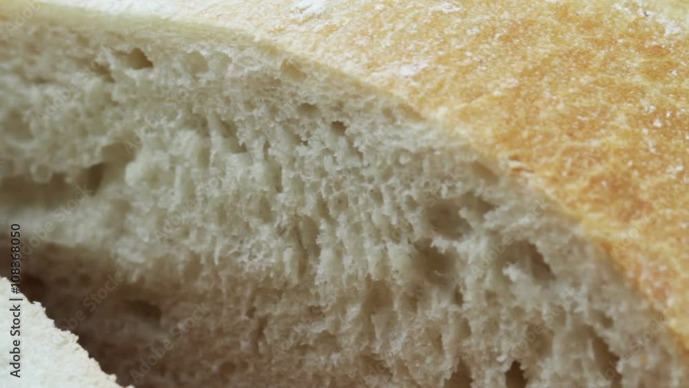 A loaf of white bread in a cut A loaf of white bread in a cut