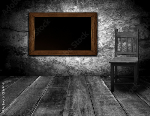 blackboard and chair in interior room