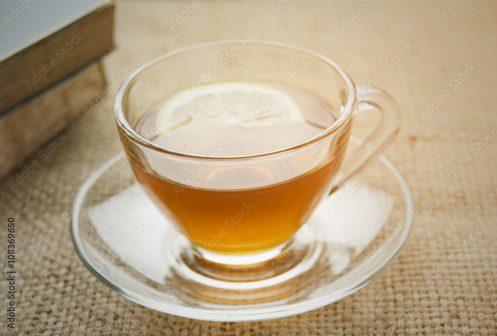Hot lemon tea on table with soft light morning. Hot lemon tea on table with soft light morning.