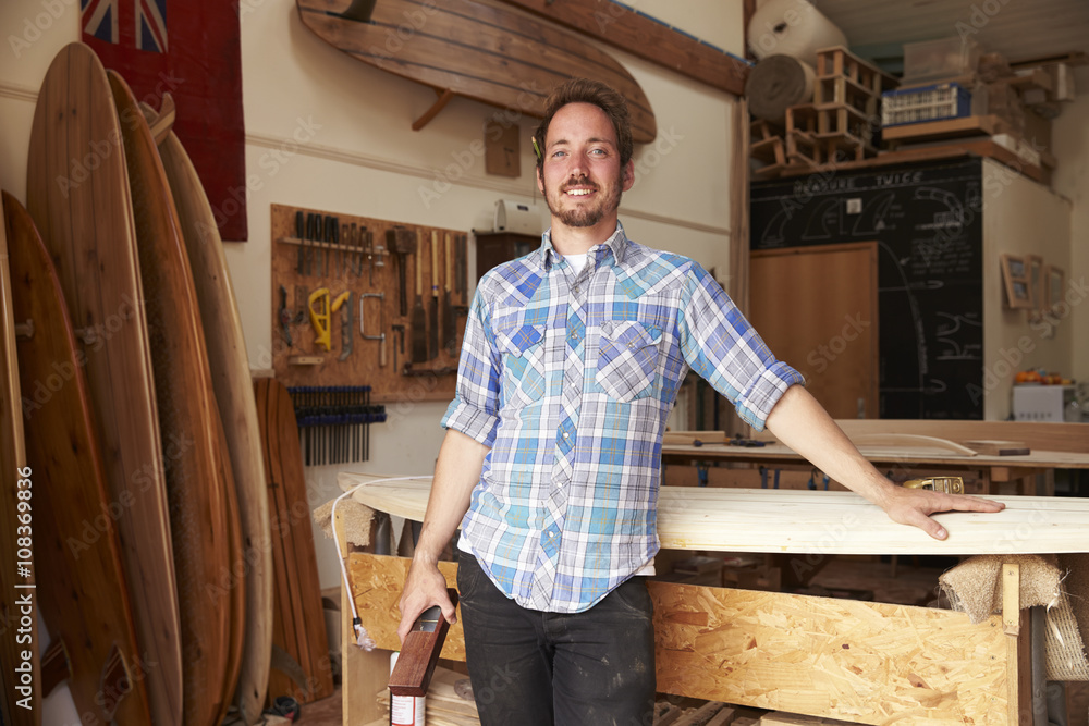 Portrait Of Carpenter In Bespoke Surfboard Workshop Portrait Of Carpenter In Bespoke Surfboard Workshop