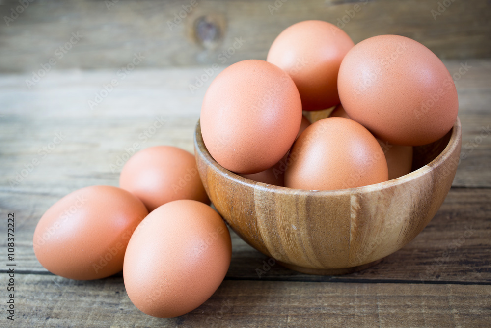 Eggs in paper tray on wood background Eggs in paper tray on wood background