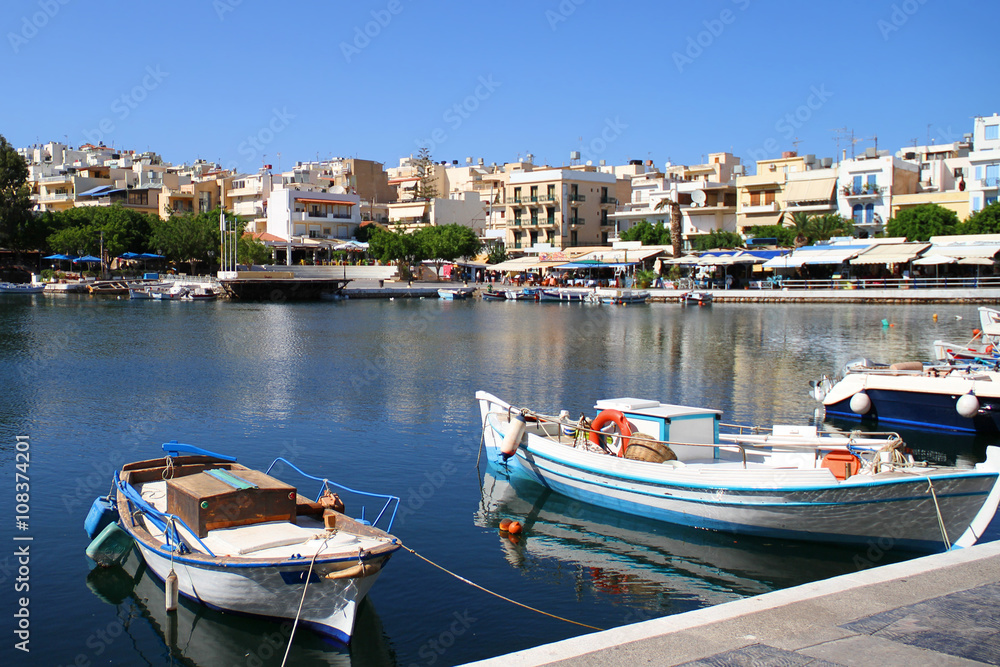 Boats Tied Up in the Bay of Voulismeni Lake - Greece, Crete, Agios Nikolaos / Lake Voulismeni located at the centre of the town of Agios Nikolaos on the Greek island of Crete