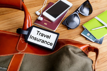 Travel insurance tag on travel bag