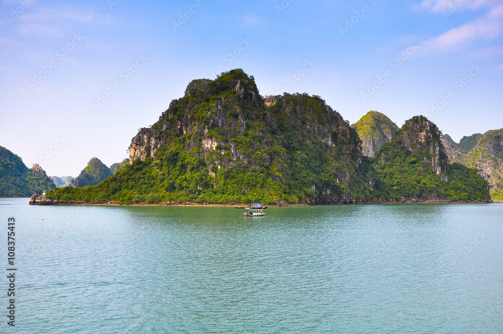 Many rocky islands covered with vegetation in Halong Bay