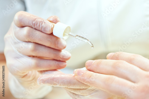 manicure specialist woman doing mail finger nail care