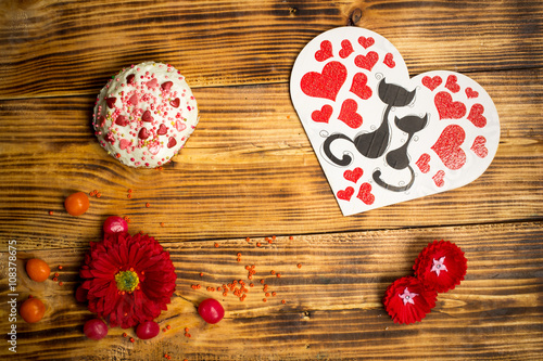 Love family card, sugar cake, red flowers wooden table