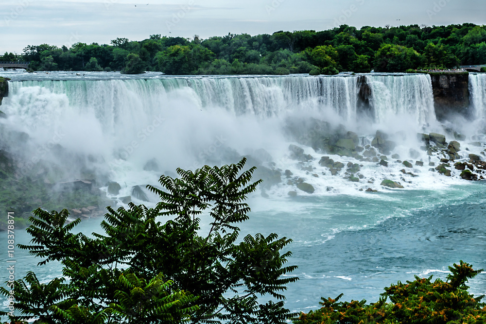 Niagara Falls closeup panorama at evening. Ontario, Canada. Niagara Falls closeup panorama at evening. Ontario, Canada.