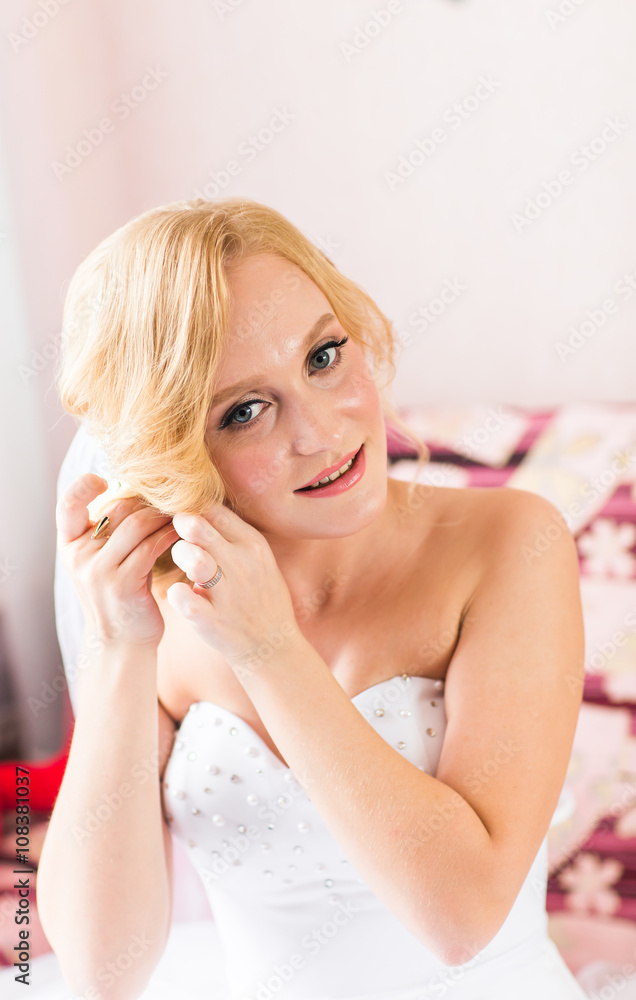 beautiful  stylish bride getting ready in the room