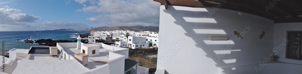 On the Northeastern coast of Lanzarote, Canary Islands, Spain. View of the village Punta Mujeres and the Atlantic ocean.