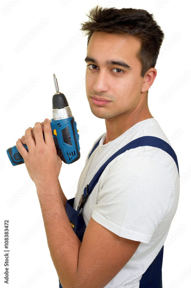 Auszubildender im Handwerk mit Akkuschrauber Auszubildender im Handwerk mit Akkuschrauber