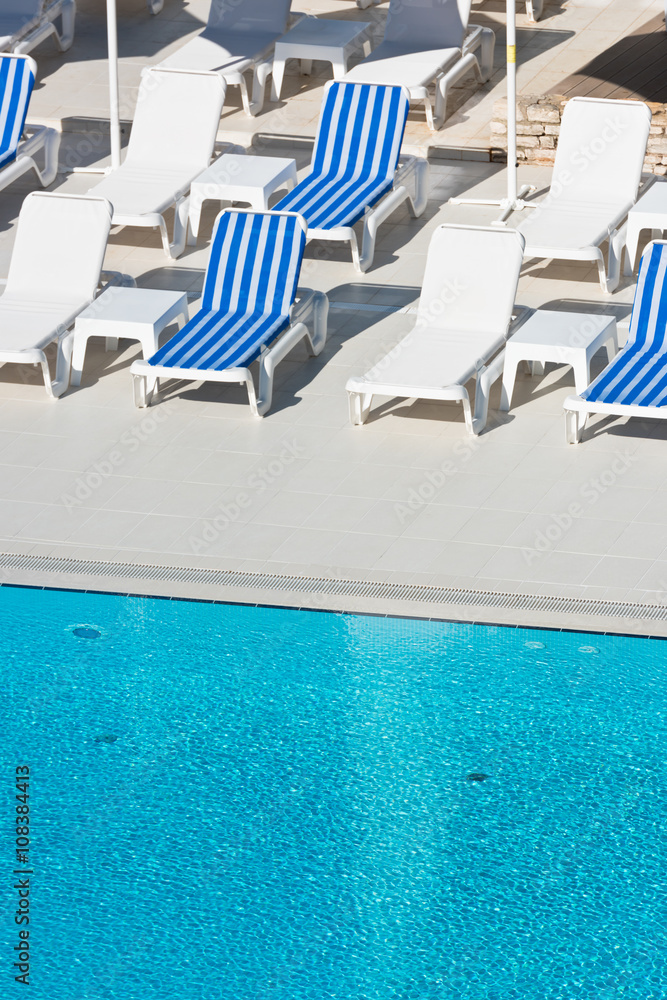 Hotel Poolside Chairs near a swimming pool