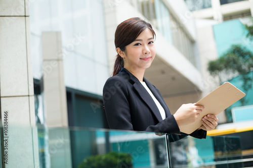 Young Business woman hold with file board Free Download Young Business woman hold with file board - GFXLoad