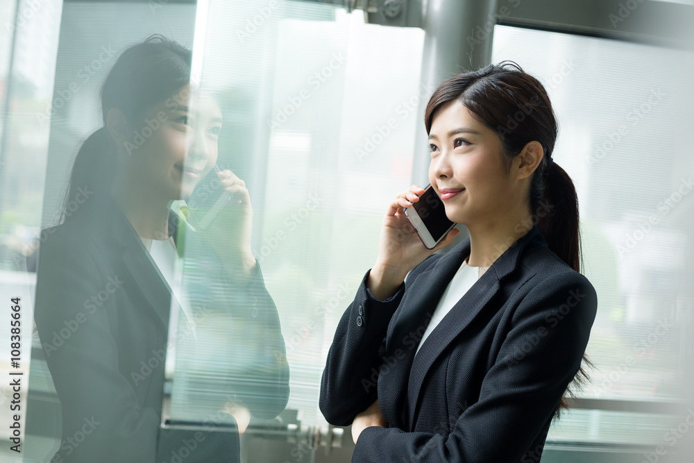 Businesswoman talk to mobile phone Businesswoman talk to mobile phone