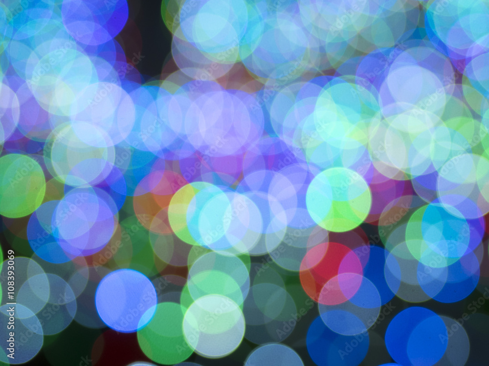 Multicolored defocused bokeh lights background Multicolored defocused bokeh lights background