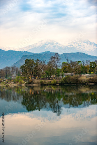 Lake Phewa in Pokhara, Nepal, with the Himalayan mountains in the background, including Machhapuchhre and Annapurna © ktianngoen0128