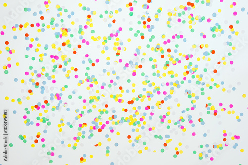confetti on a white sheet of paper