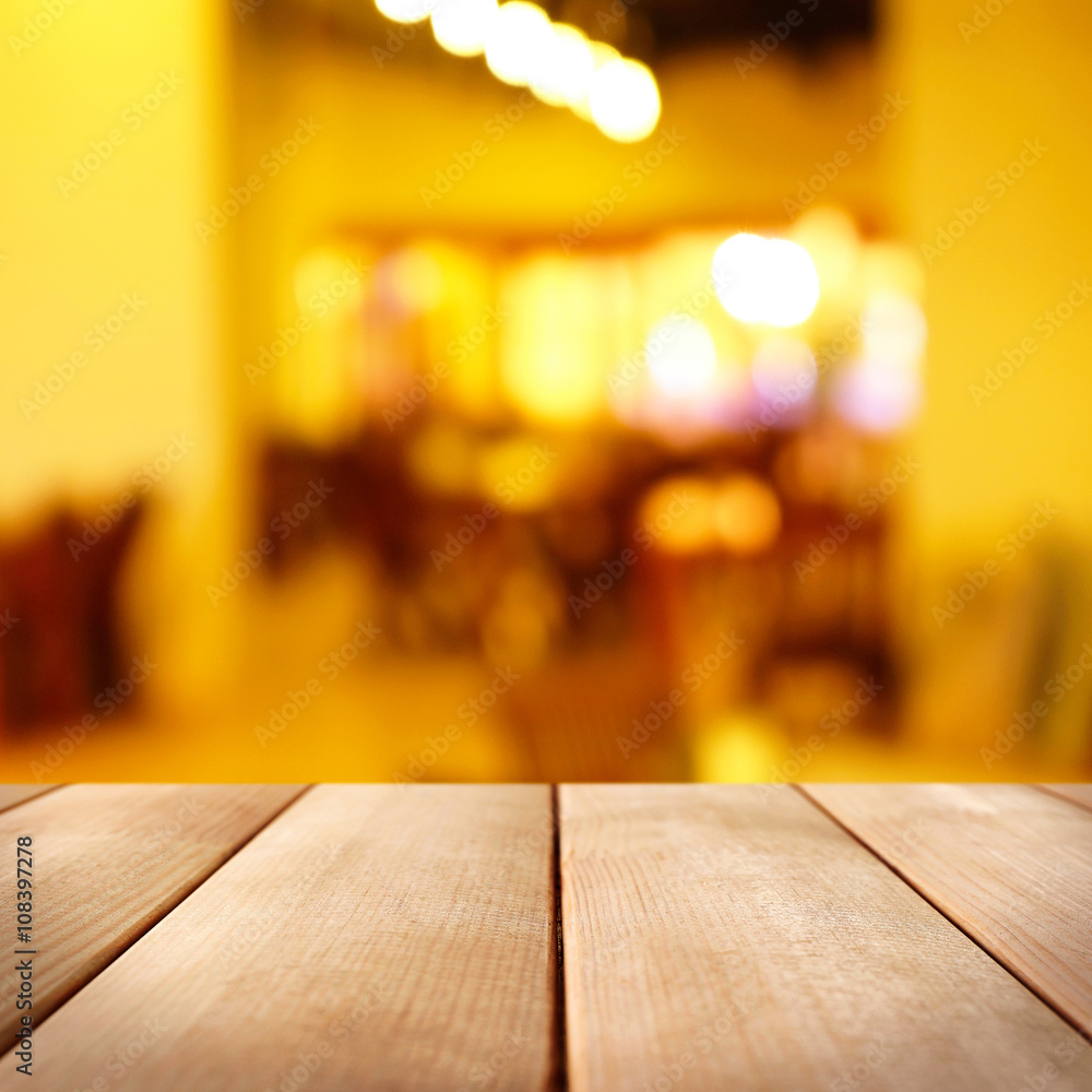 Empty wooden table and blurred interior background Empty wooden table and blurred interior background