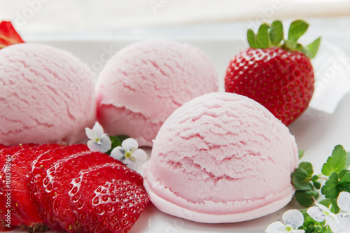 strawberry ice cream ball with fresh strawberries