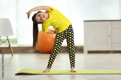 Little cute girl stretching...