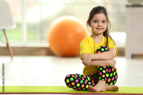 Little cute girl sitting on...