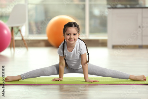 Little cute girl stretching...