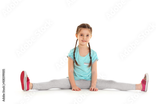 Little cute girl sitting in...