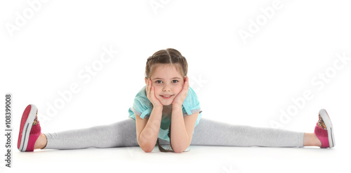 Little cute girl sitting in...