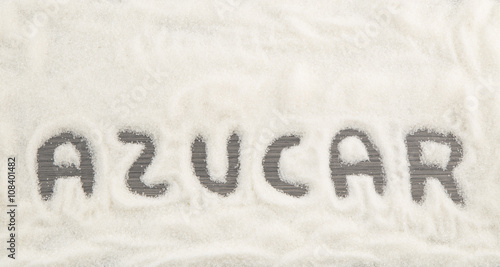sugar inscription made on the stack of white granulated sugar (Spanish)