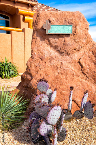 Cactus rock front garden with address plate. American Southwest style