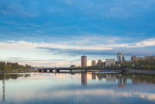 Night city reflection on the river in Donetsk. Ukraine