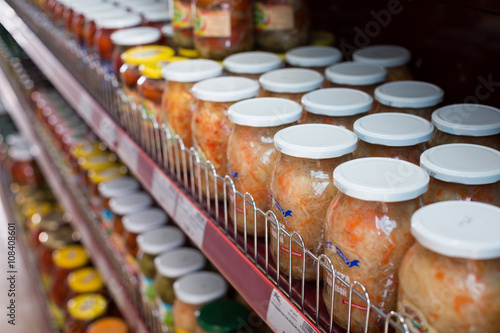Fototapeta Naklejka Na Ścianę i Meble -  Glass food products and pickles in Russian food store