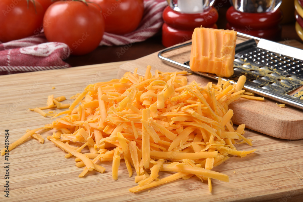 Grated cheddar cheese Stock Photo Adobe Stock
