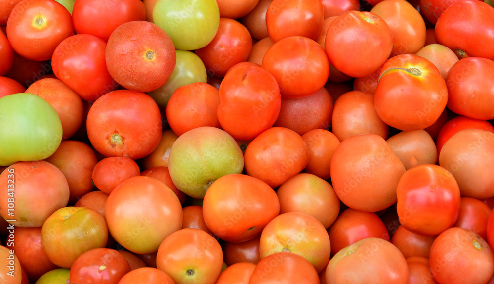 Red tomatoes background.
Red tomatoes background.