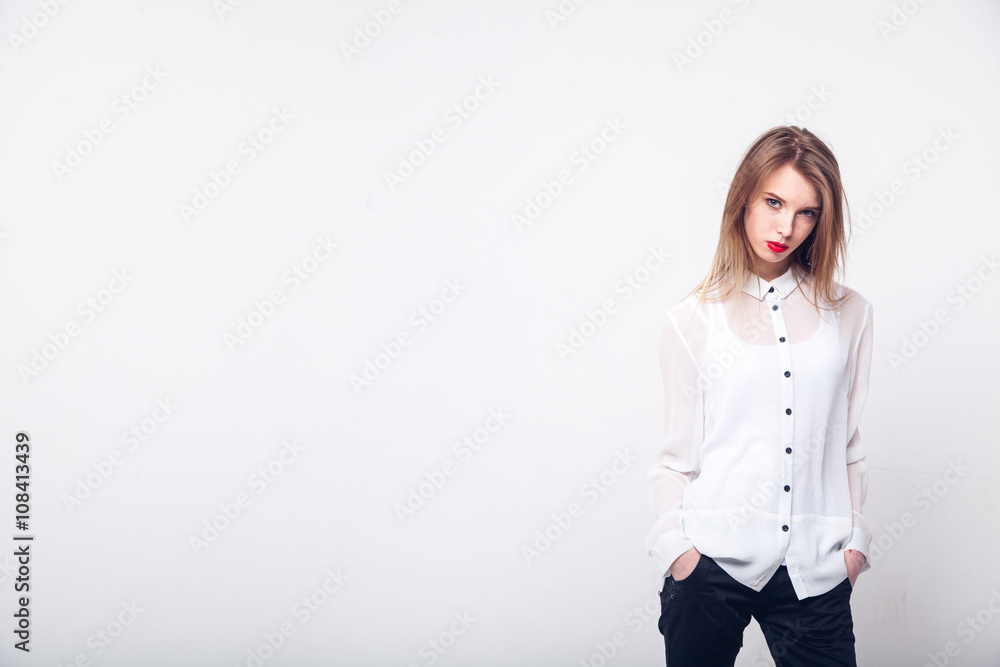 Portrait of a fashionable young brunette beauty in white shirt. Portrait of a fashionable young brunette beauty in white shirt.