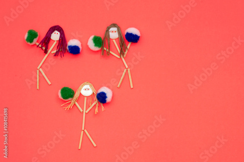 Cheerleader button head stick figures with pink and red pompoms 