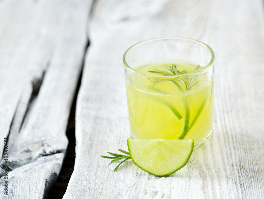 Fototapeta premium lime lemonade on wooden background