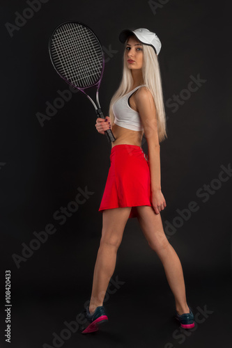 Tennis player with racket