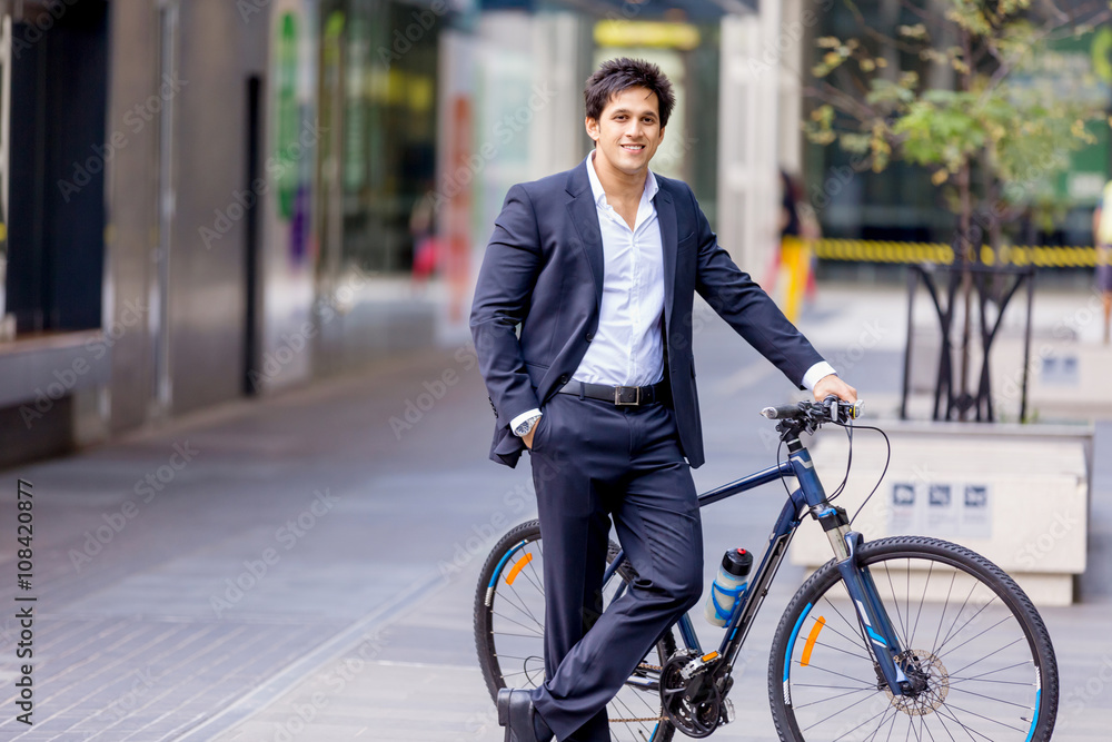 Successful businessman riding bicycle Successful businessman riding bicycle