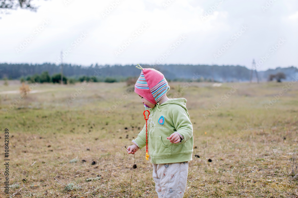 Funny baby girl with flower in hand Funny baby girl with flower in hand