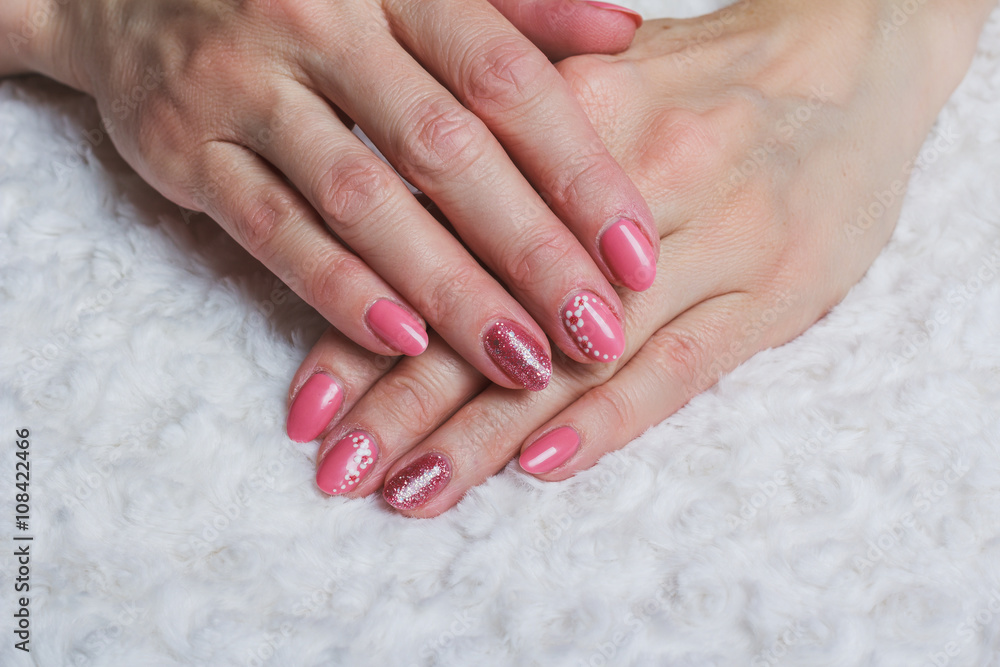 Pink nail art with flower on textile