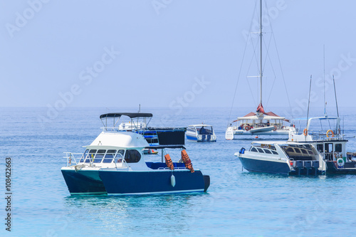 tourist speed boat floating in harbor port phuket island souther
