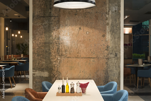 Modern restaurant interior with concrete wall
