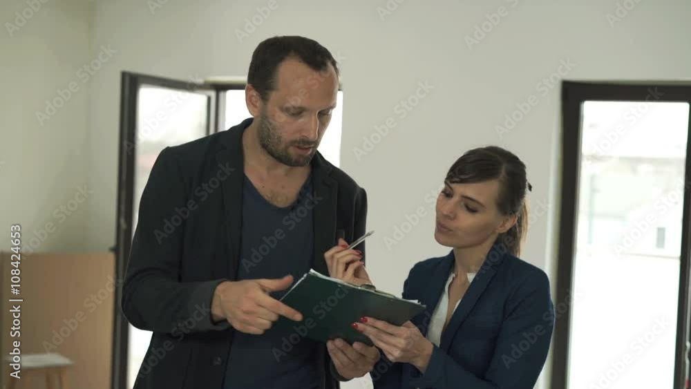 Real estate agent selling new home to man and signing contract
Real estate agent selling new home to man and signing contract