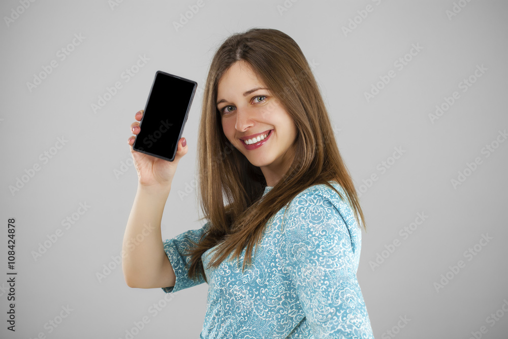 Pretty brunette showing smart phone Pretty brunette showing smart phone